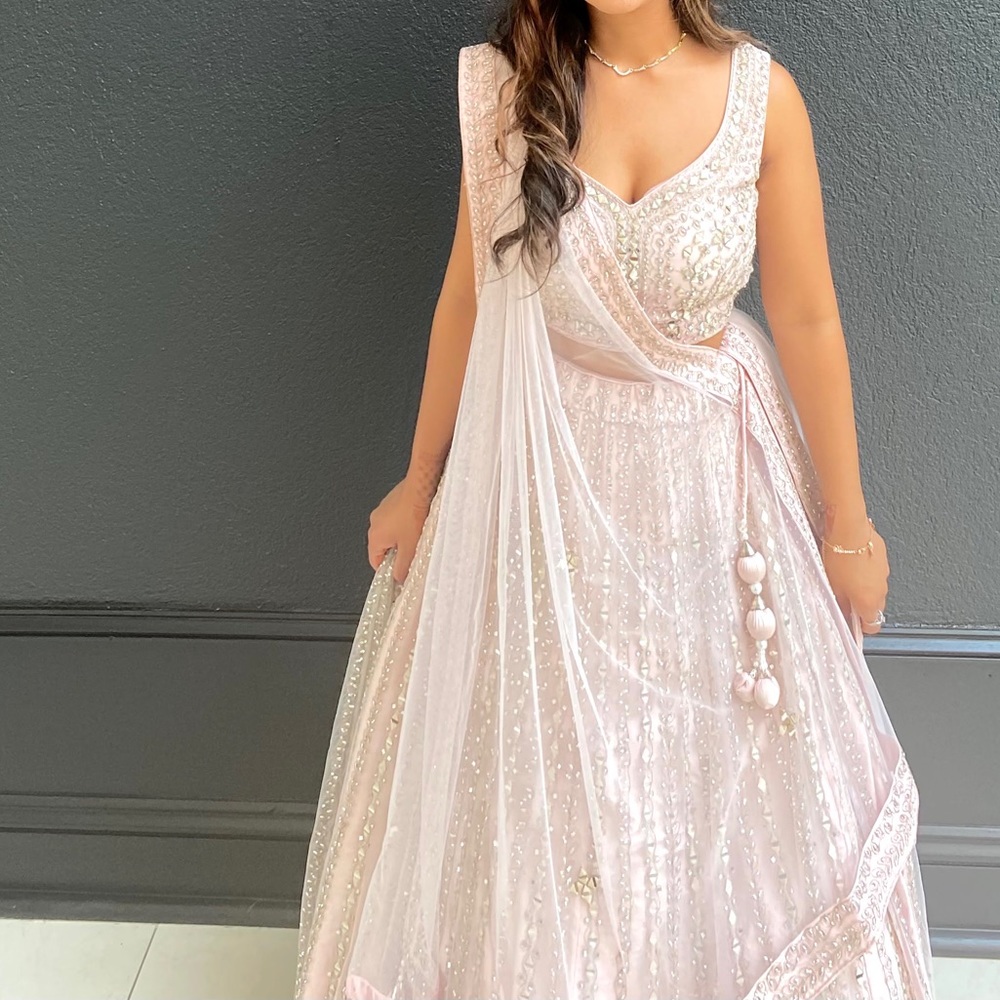 Heavenly pink embroidered lehenga set for Indian wedding with a V-neckline